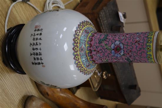A pair of Chinese bottle-shaped vase table lamps, decorated with flowers in polychrome enamels height 38cm excl. fittings